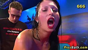 hot fetish babe gets drenched in steamy golden shower play