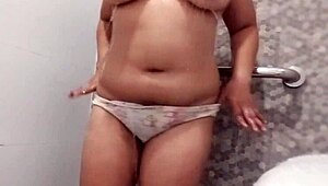 Sexy Filipina showers bubbly water over huge natural boobs