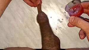 I drip wax onto my long tattooed foreskin