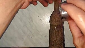 I drip wax onto my long tattooed foreskin