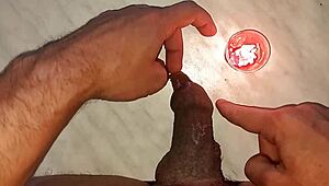 I drip wax onto my long tattooed foreskin