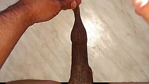 I drip wax onto my long tattooed foreskin