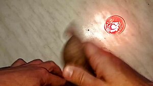 I drip wax onto my long tattooed foreskin