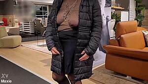 My Wife Browsing Outfits While Shopping In Busy Store