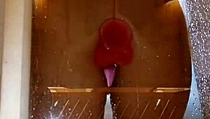 girl with an appetizing ass is having fun in the shower with a pink dick