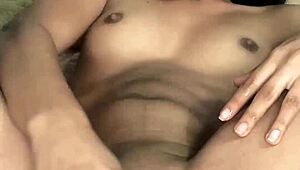 Young petite babe enjoys solo toy play at home