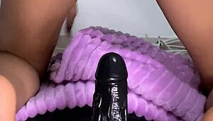 Young petite babe enjoys solo toy play at home