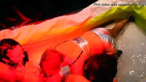 sexy lesbians oil up and wrestle
