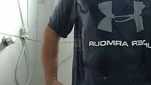 a masked tattooed man takes a shower alone and enjoys playing with his toy until he cums