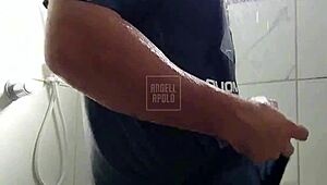 a masked tattooed man takes a shower alone and enjoys playing with his toy until he cums