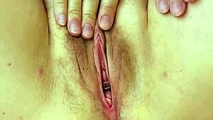 Granny teases with huge tits and pussy