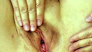 Granny teases with huge tits and pussy