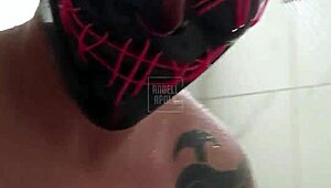 a masked tattooed man takes a shower alone and enjoys playing with his toy until he cums