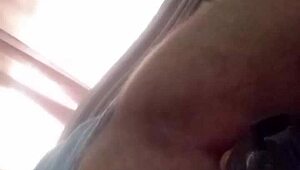 Mature shakes ass with toy in anal play