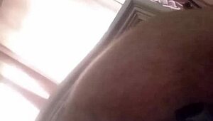 Mature shakes ass with toy in anal play
