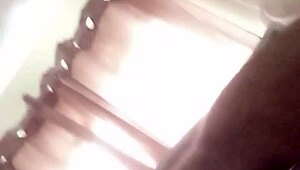 Mature shakes ass with toy in anal play